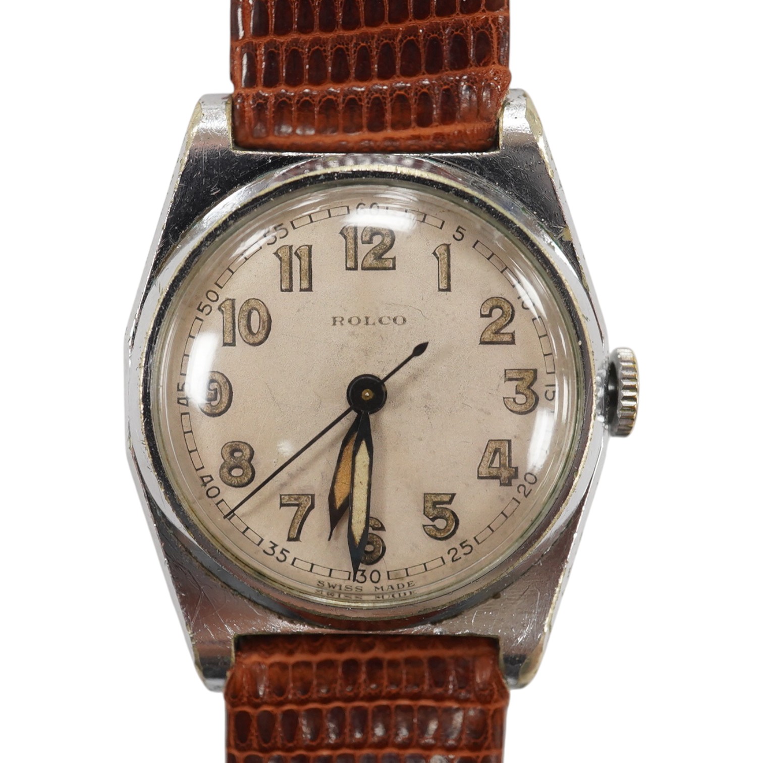 A gentlemen's mid 20th century stainless steel Rolco manual wind wrist watch, with Arabic dial, the case back with engraved monogram and numbered 595943 over 274, case diameter 29mm, on a later associated leather strap.